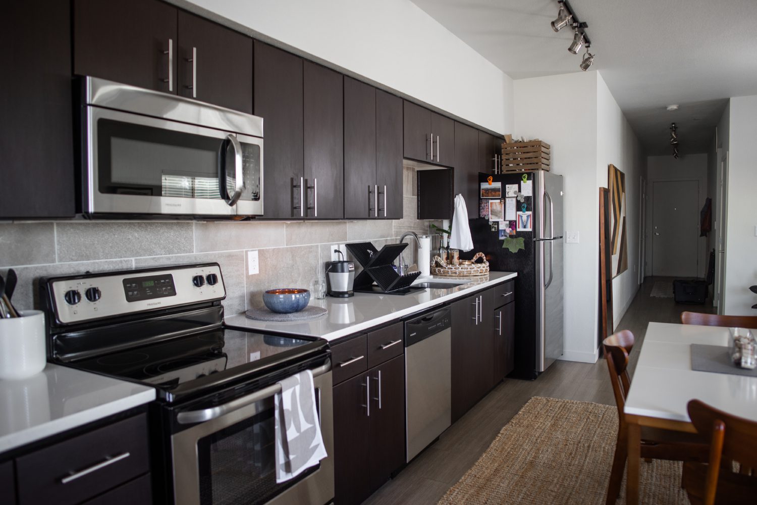 Kitchen with stainless steel appliances and dining area