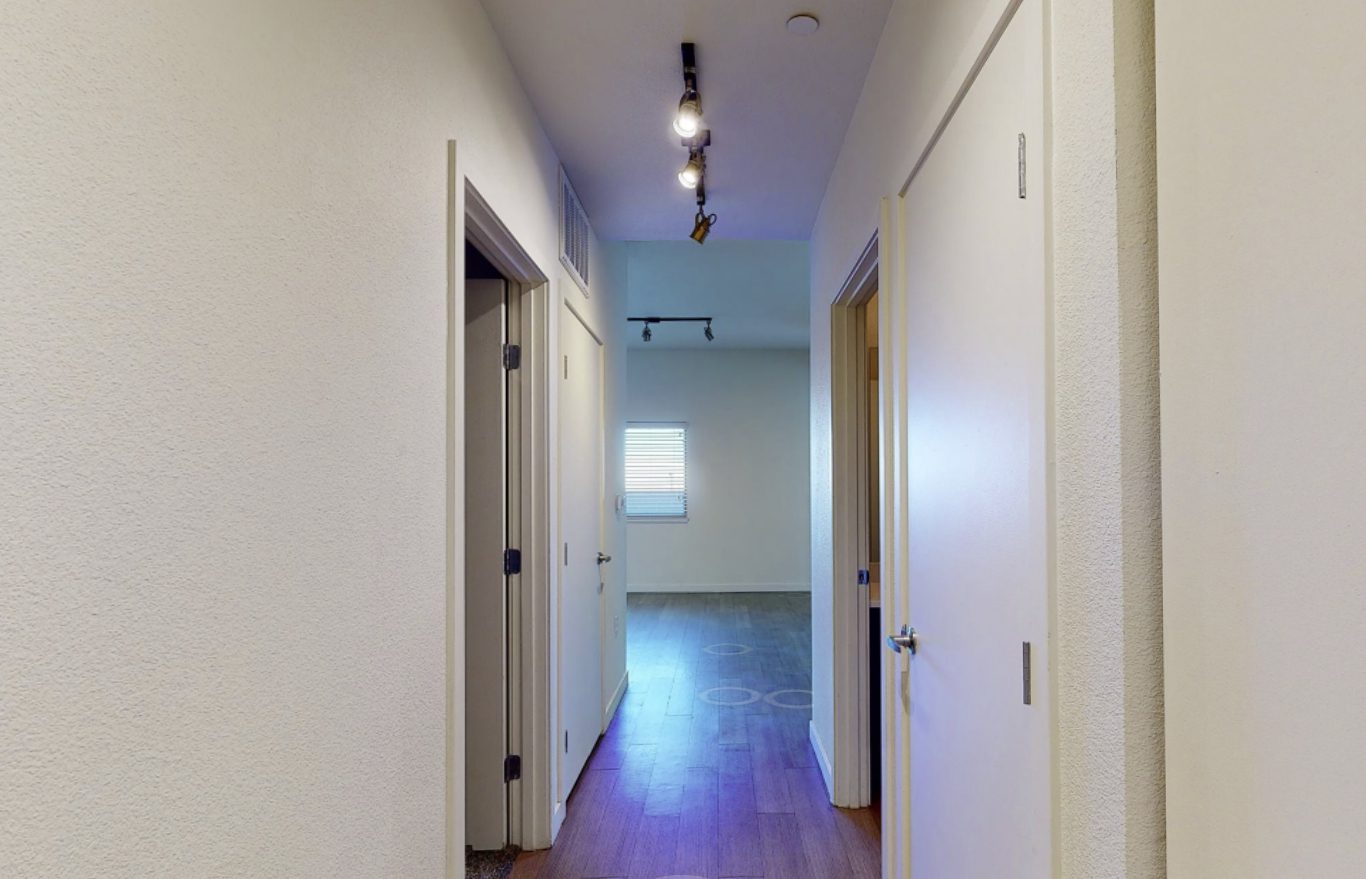 Apartment hallway with track lighting